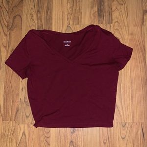 V-neck crop top shirt. Fits like a small but is a medium
